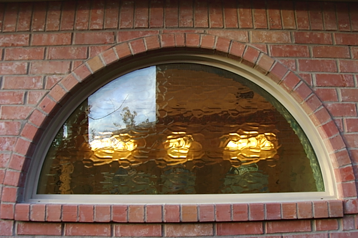 Close Up of a Flemish Bathroom Arc Window